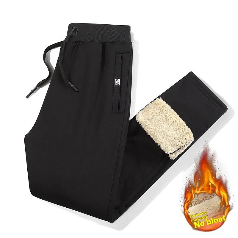 Men's grey fleece-lined oversized cotton track pants with a straight leg on a hanger.