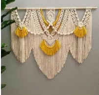 Hand-woven creamy white and yellow Nordic style cotton tapestry hanging on a wall