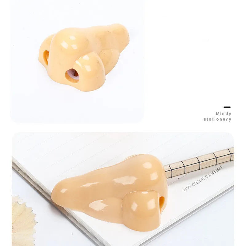 Flesh coloured plastic geometry design pencil sharpener with large casing, shown alongside a pencil.