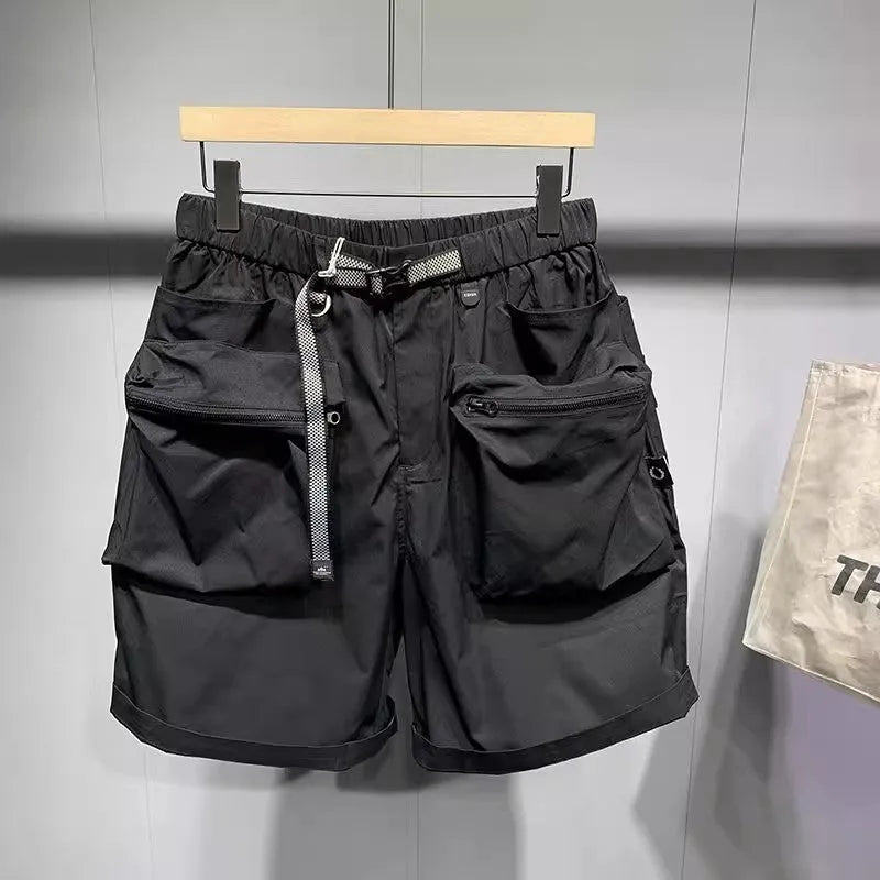 Men's loose fit black casual shorts with pockets and straight leg hem.