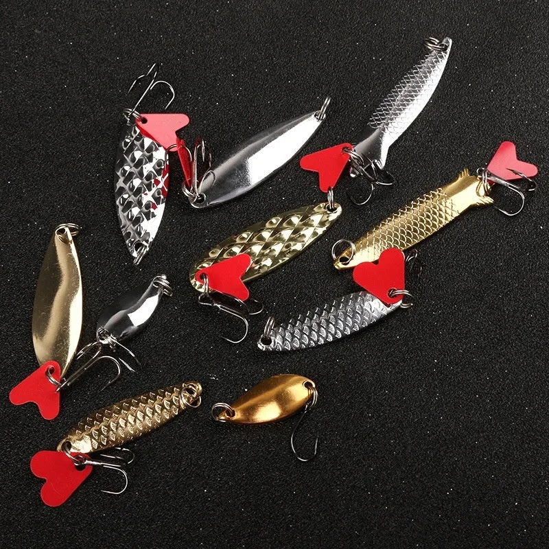 Pineapple sequin fishing lures in gold and silver colours with metal sequins on iron false bait bodies