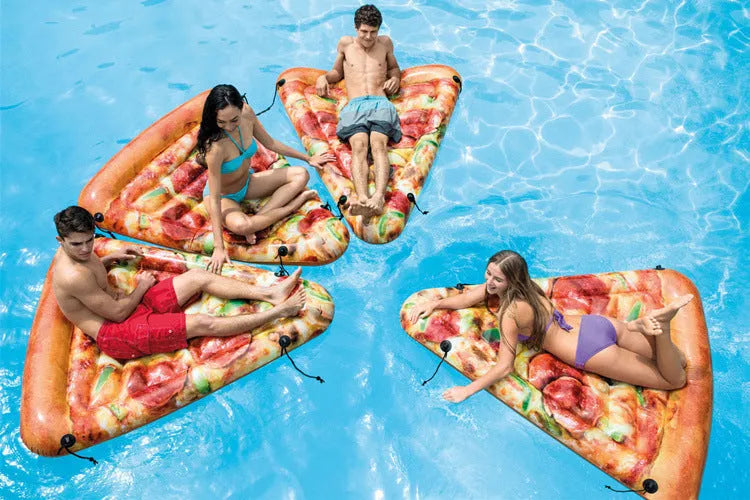 Large inflatable pizza-themed surfboard lounger floating on water.
