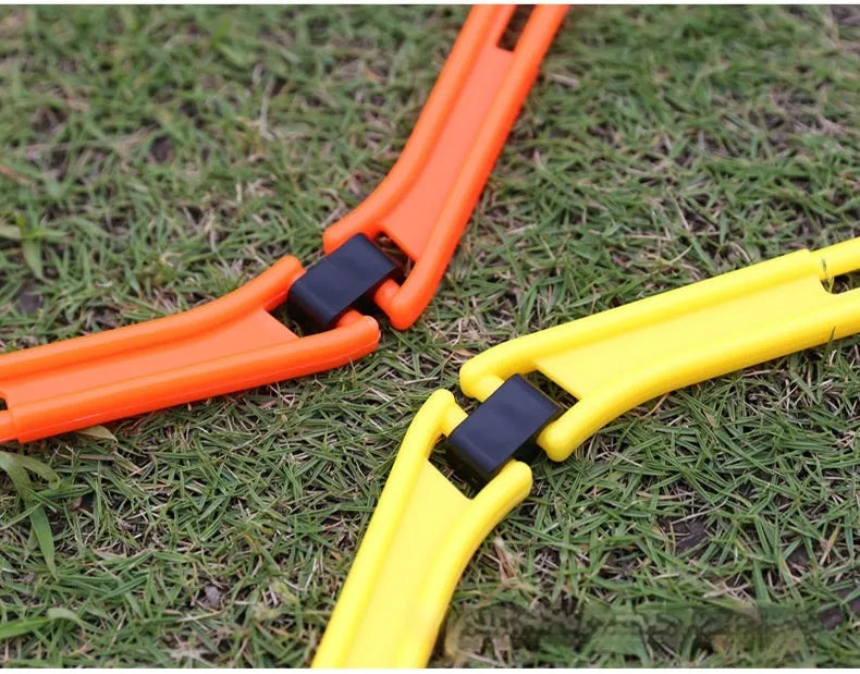 Set of six foldable yellow, green, and orange hexagon plastic agility training rings for football drills.
