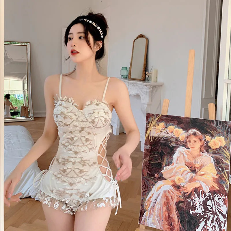 White Korean style one-piece swimsuit with a waist hollow cut and backless design.