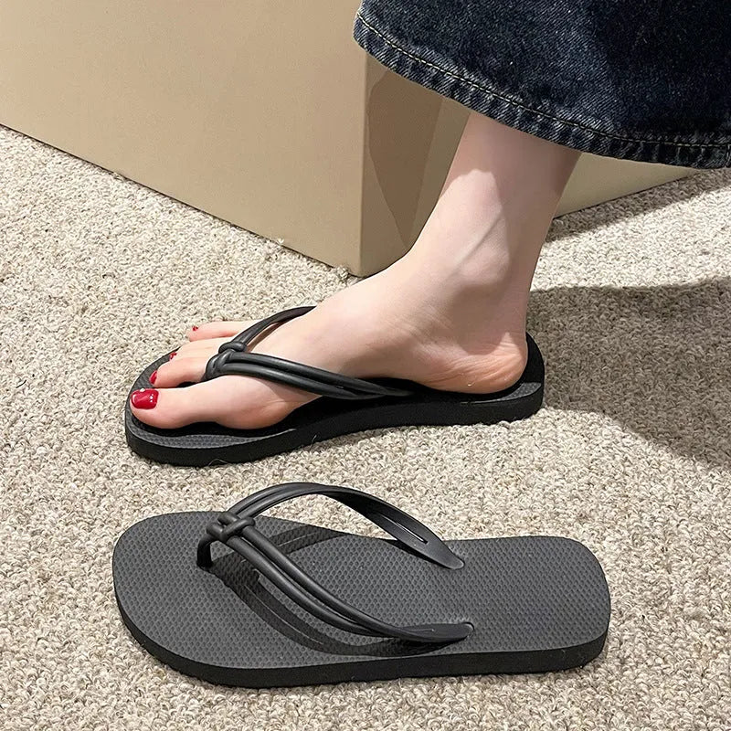 Women's pink flip flops with toe-covering design and non-slip PVC sole for summer outdoor wear
