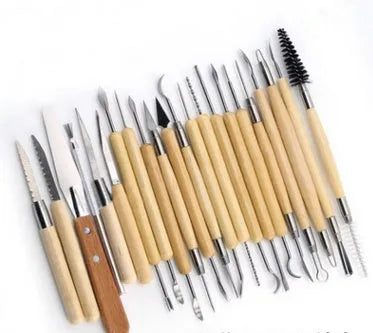 27-piece pottery tool set with stainless steel sculptors and wood tools rolled in a brown package.