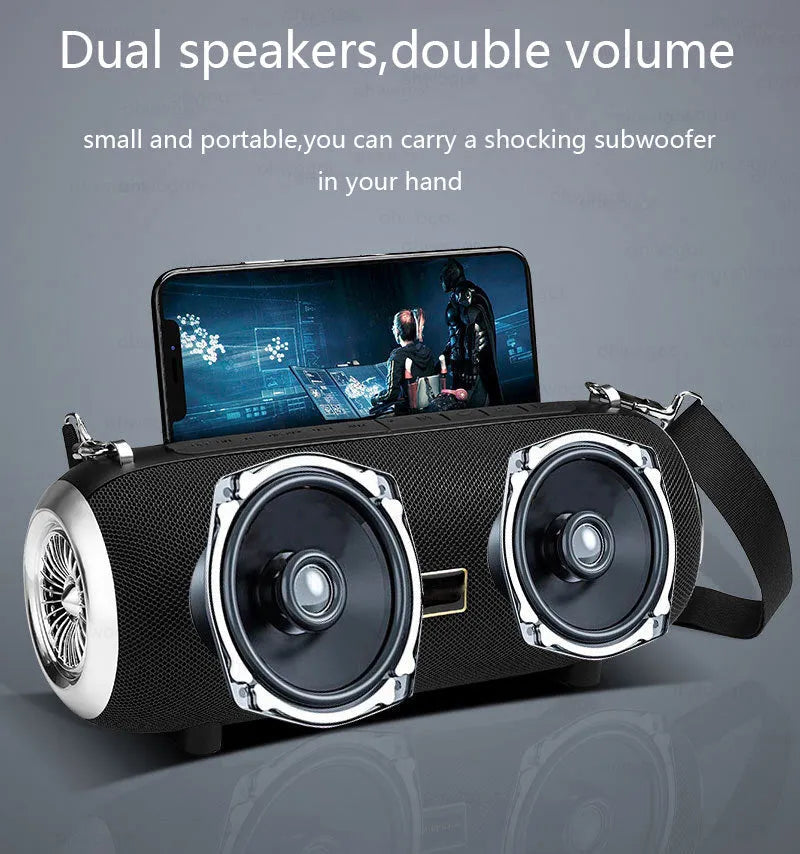 F666 square fabric portable Bluetooth speaker with shoulder strap on a table