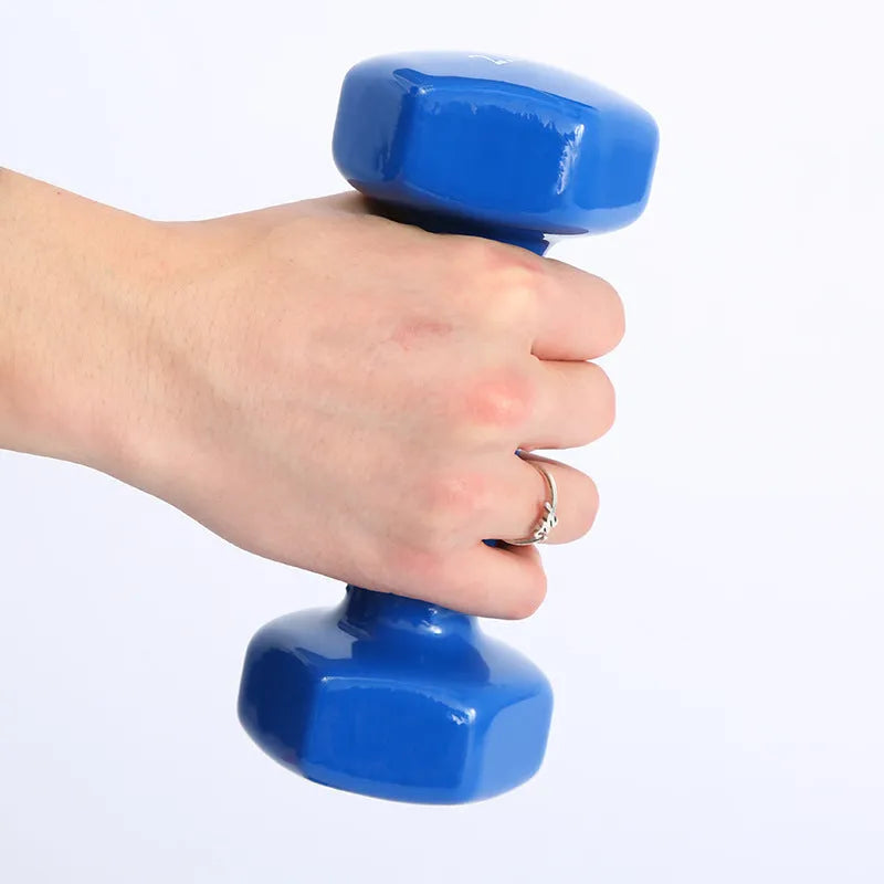 Bright colourful plastic dumbbells for home fitness workouts with glossy floor-protecting surface