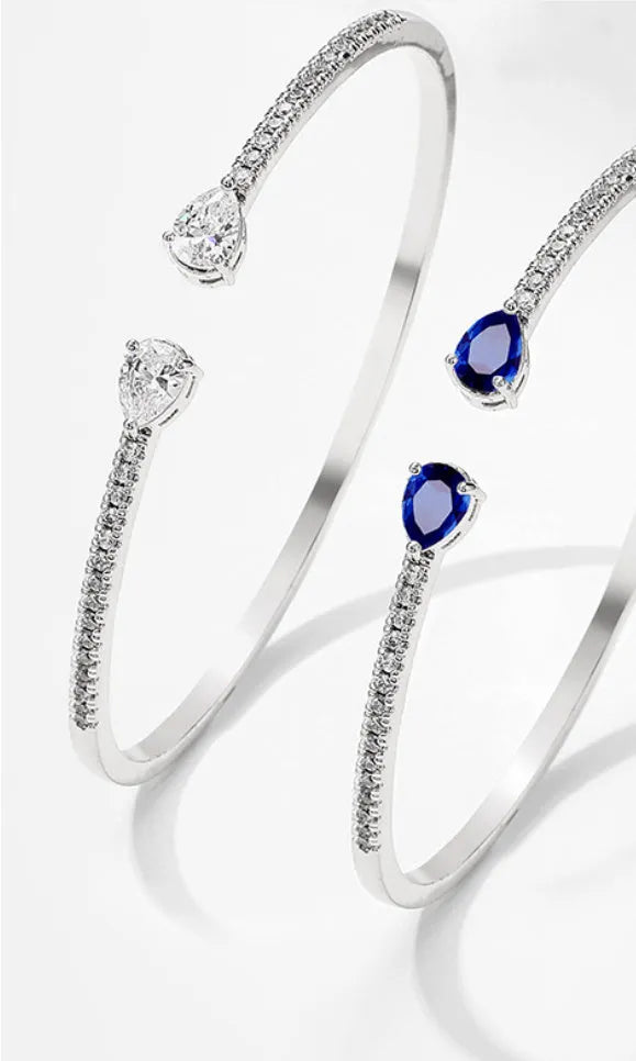 Copper bracelet with multi-zircon inlay stones in simple style, shown in white and blue colour options
