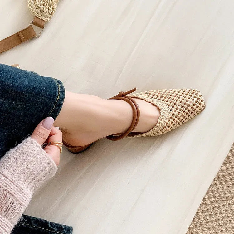 Women's black French-style outdoor slippers with hollow-out design and a thick square chunky heel.