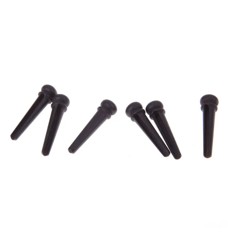 Set of six matt black ebony guitar string nails for folk acoustic instruments