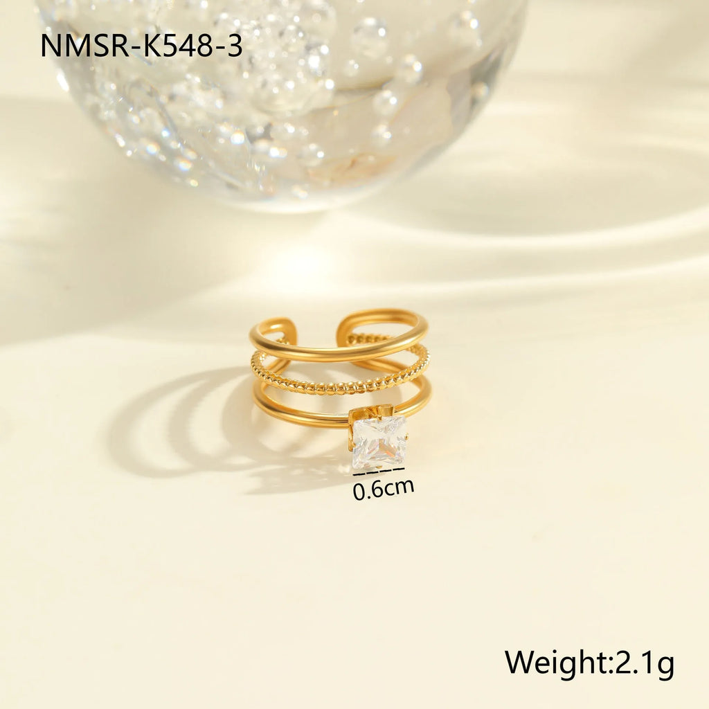 Gold plated adjustable ring with zircon stones in a geometric heart and drop shape design