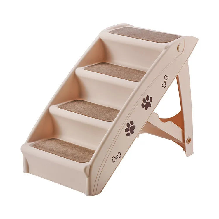 Foldable grey pet stairs with non-slip mats placed next to a sofa for dog or cat use