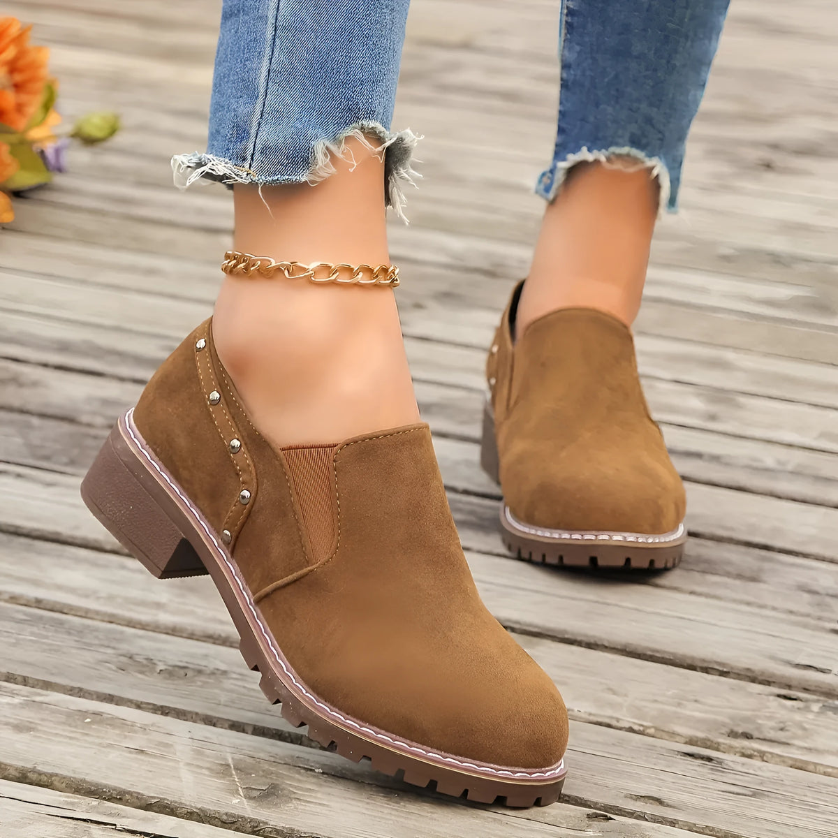 Women's light brown suede ankle boots with elastic band and thick low heel on rubber sole
