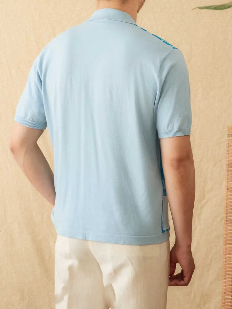 Man wearing a royal blue striped short-sleeved polo cardigan with a lapel collar.