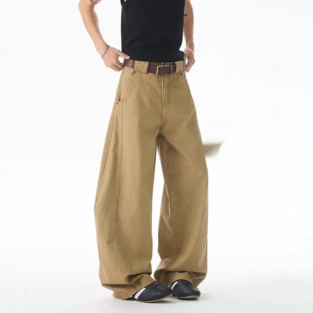 Men's brown loose fit denim jeans with straight leg and button fly