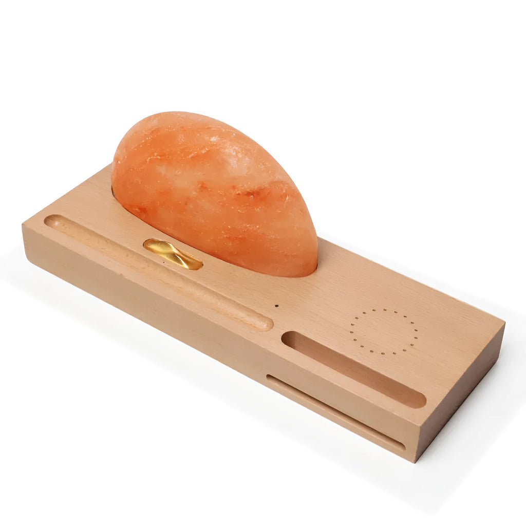 Sunrise Oriental table lamp with natural salt shade on wood base, showing wireless phone charging.