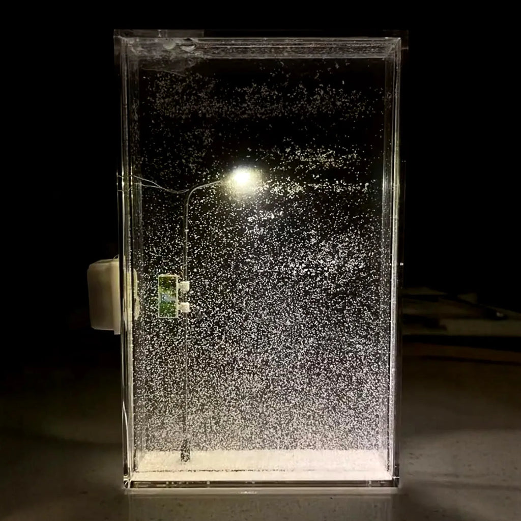 DIY snowflake night light kit showing magical snowy landscape scene with warm LED glow