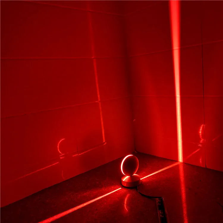 Modern aluminium and glass LED spotlight bar wall lamp mounted on a wall.