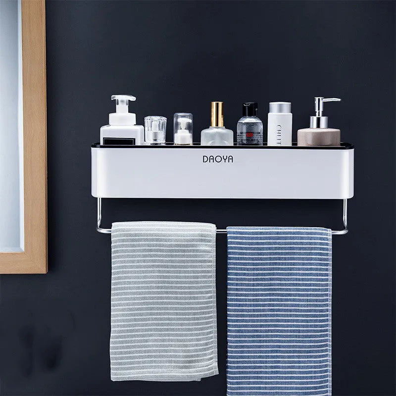 Black wall-mounted bathroom shelf with hole-free installation holding shampoo and shower gel bottles