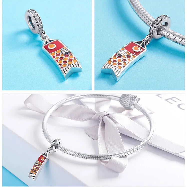 S925 sterling silver carp streamer pendant necklace with zircon stones and oil drop detailing.