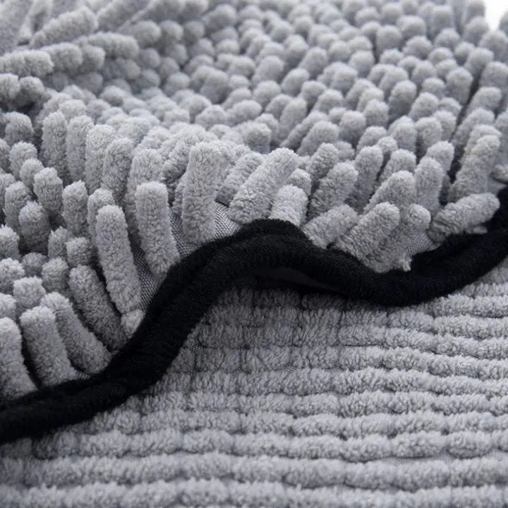 Blue pet bath drying towel for dogs and cats, 62 cm long by 23 cm wide.