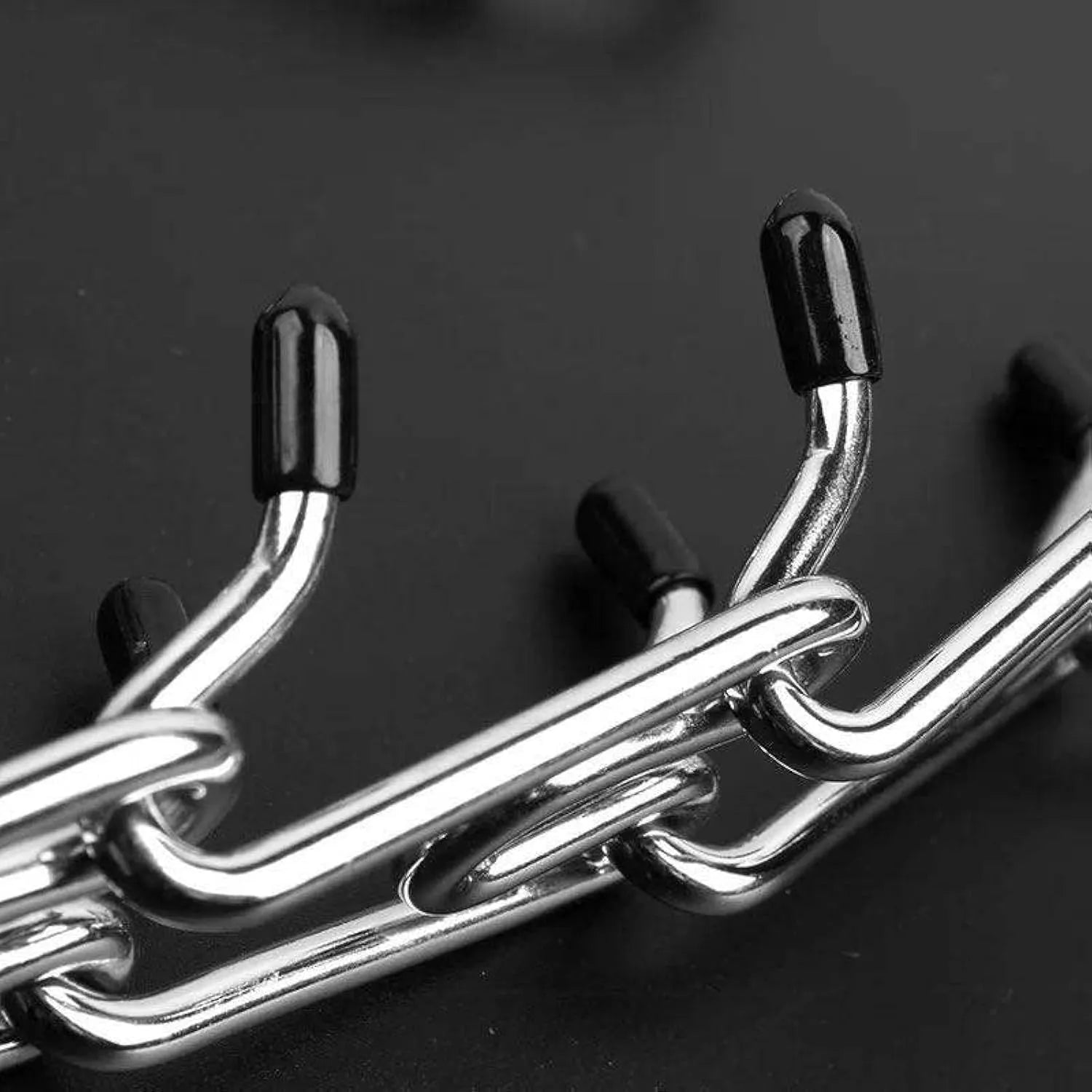 Stainless steel dog training pinch collar with rubber-tipped prongs and adjustable chain links