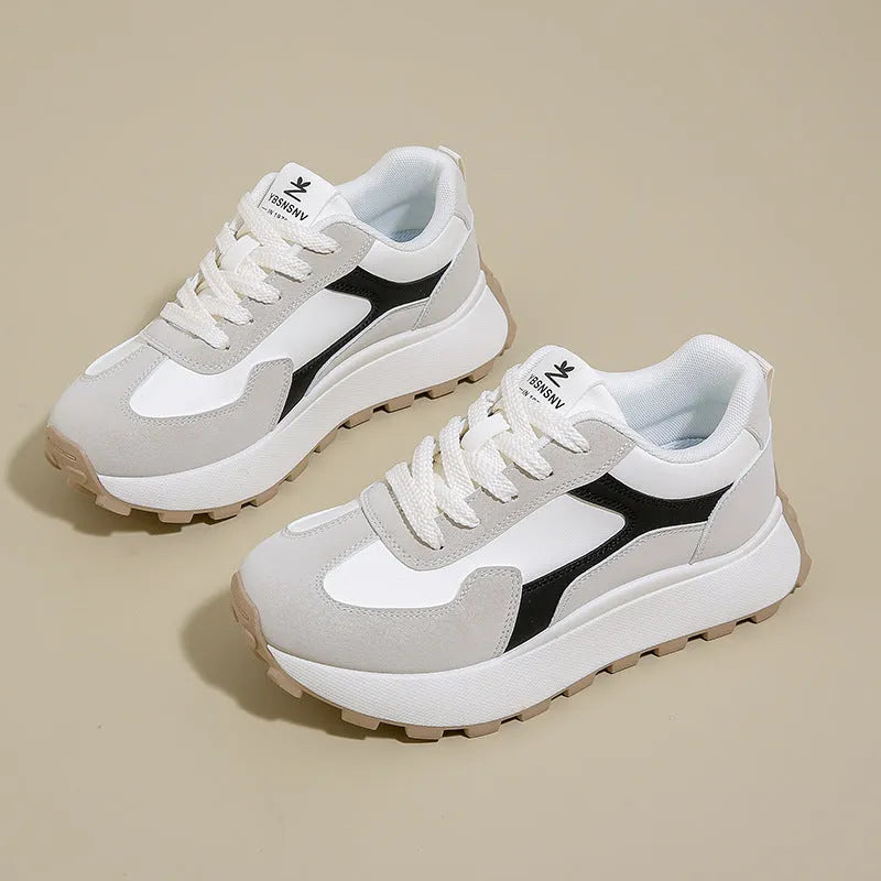 Women's solid colour platform sports running shoes with mesh upper and rubber sole in three colour options.