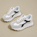 Women's solid colour platform sports running shoes with mesh upper and rubber sole in three colour options.