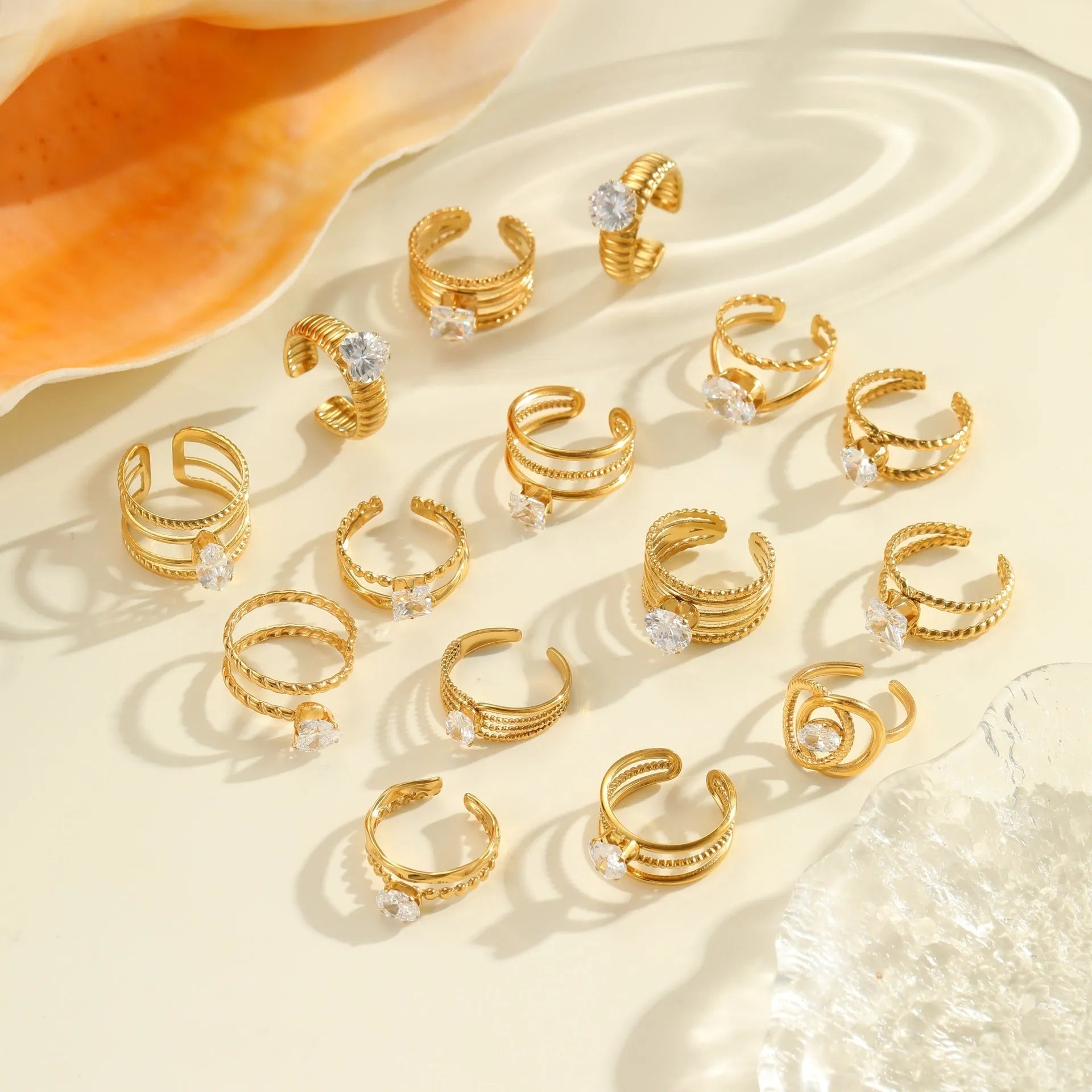 Gold plated adjustable ring with zircon stones in a geometric heart and drop shape design