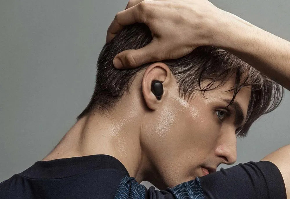 Redmi AirDots 2 black true wireless earbuds with charging case on a white background.