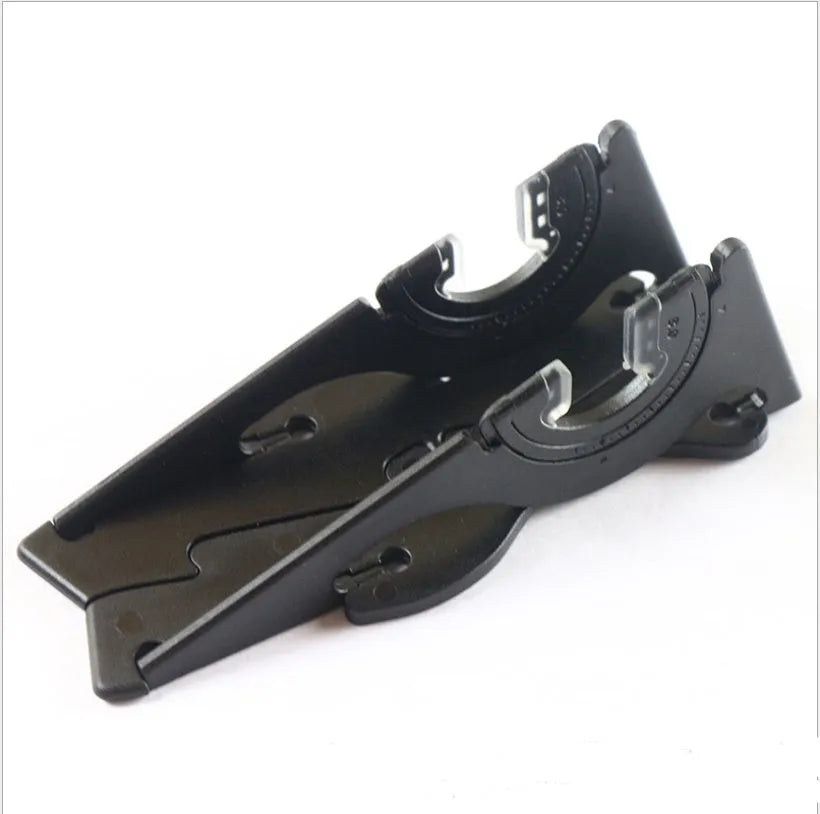 Black foldable ABS plastic mobile phone holder bracket stand on a desk