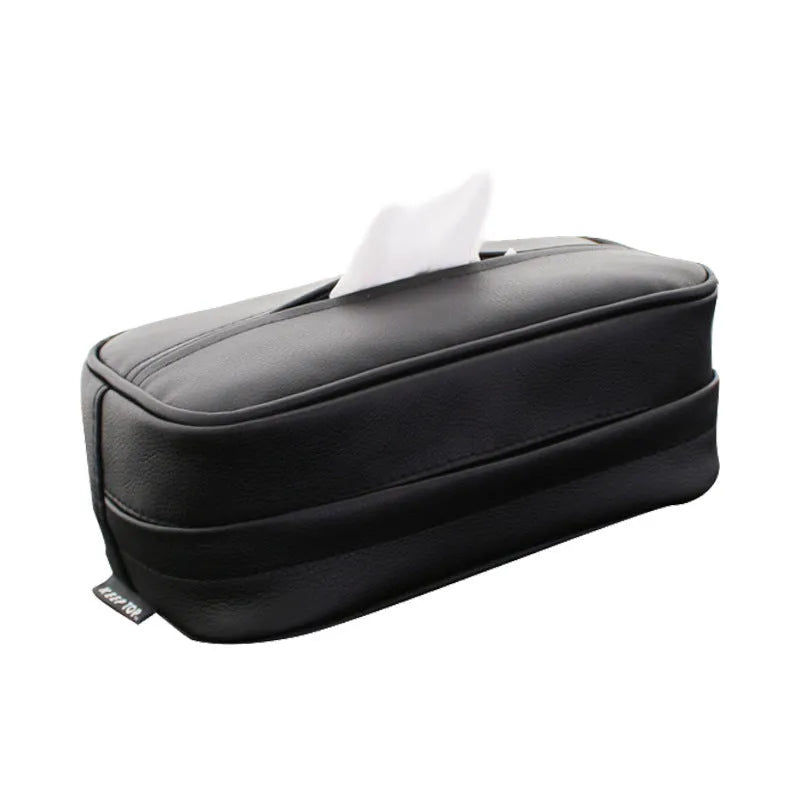 Black PU leather hanging storage box for car console organisation, shown with paper bag filler.