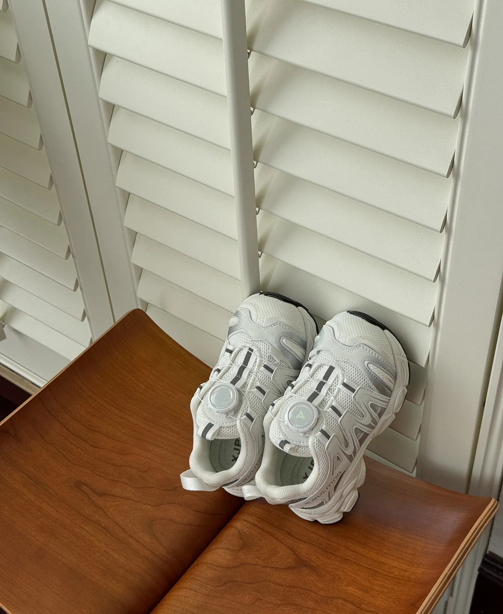 Girls' lightweight casual shoes in breathable PU leather mesh, shown in solid black, beige, or pink.