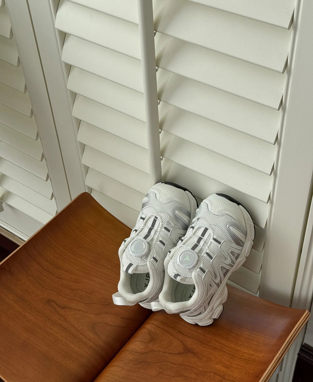 Girls' lightweight casual shoes in breathable PU leather mesh, shown in solid black, beige, or pink.