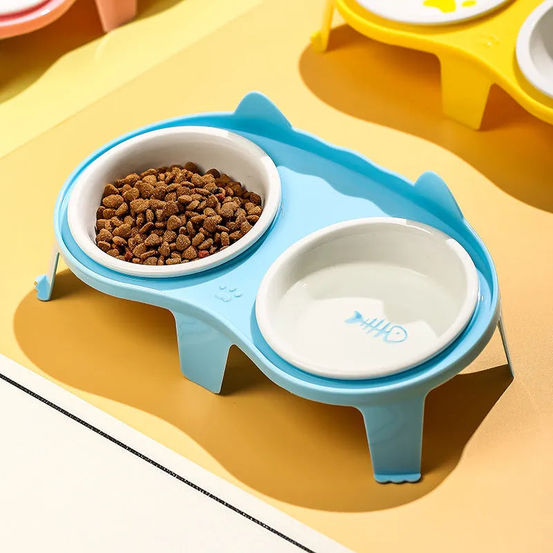 Blue ceramic tilted cat food and water bowls on a white ABS stand with a hook for a water bottle.