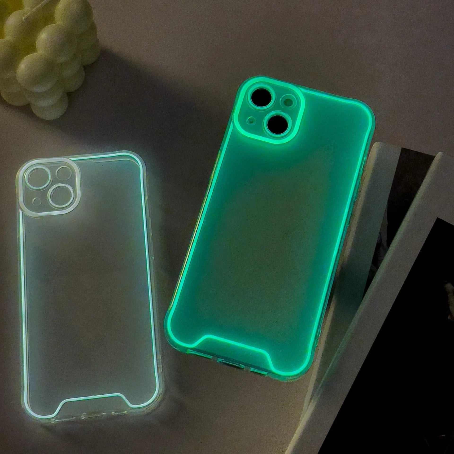 Glow in the dark green soft TPU phone case for Apple iPhone on a dark background.