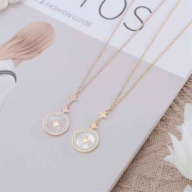 Geometric six-pointed star titanium steel necklace on a model, showing rose gold and gold colour options.