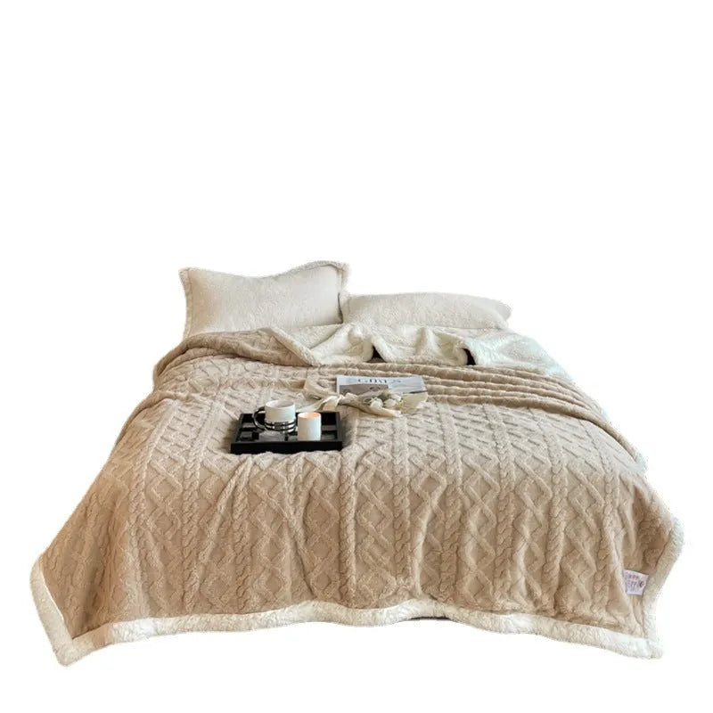 Polyester thermal flannel blanket in beige colour showing modern simple style on a bed.