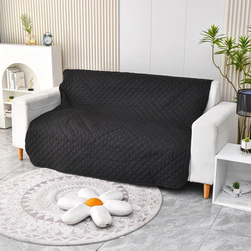 Reversible waterproof dog blanket on sofa showing two colour options with multiple size measurements