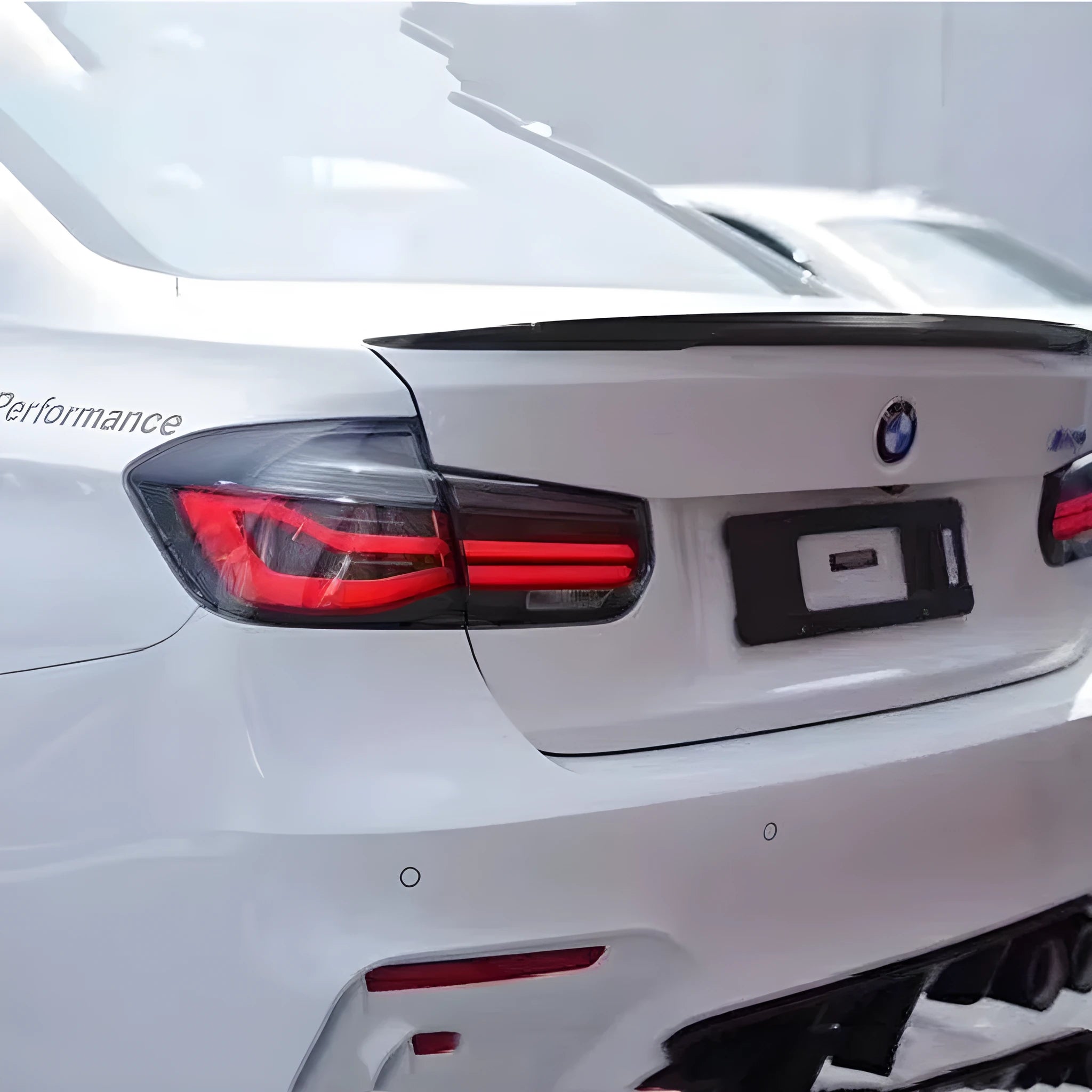 BMW 3 Series aftermarket tail light assembly with streamer design and LED running lights