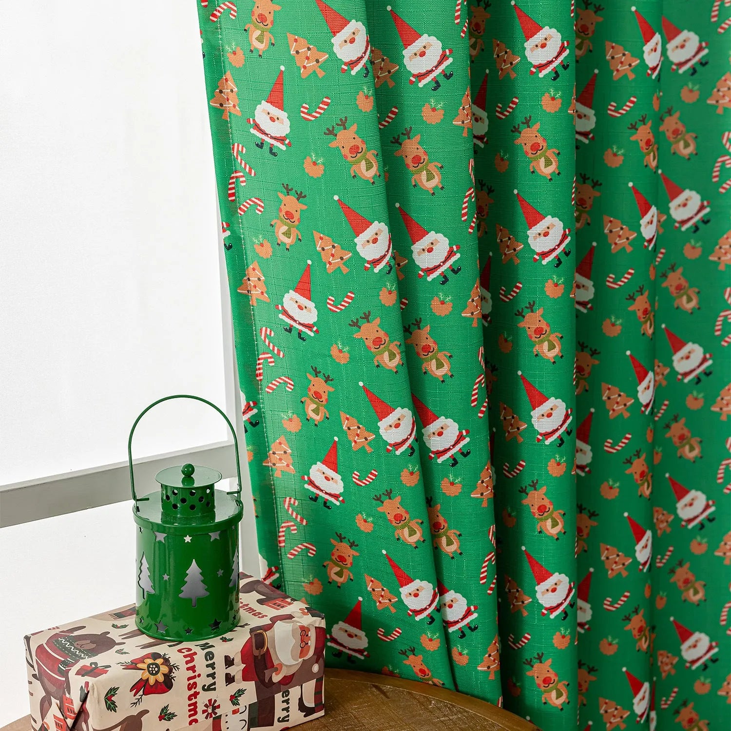 Christmas snowman angel print curtain in green colour with cartoon figures pattern