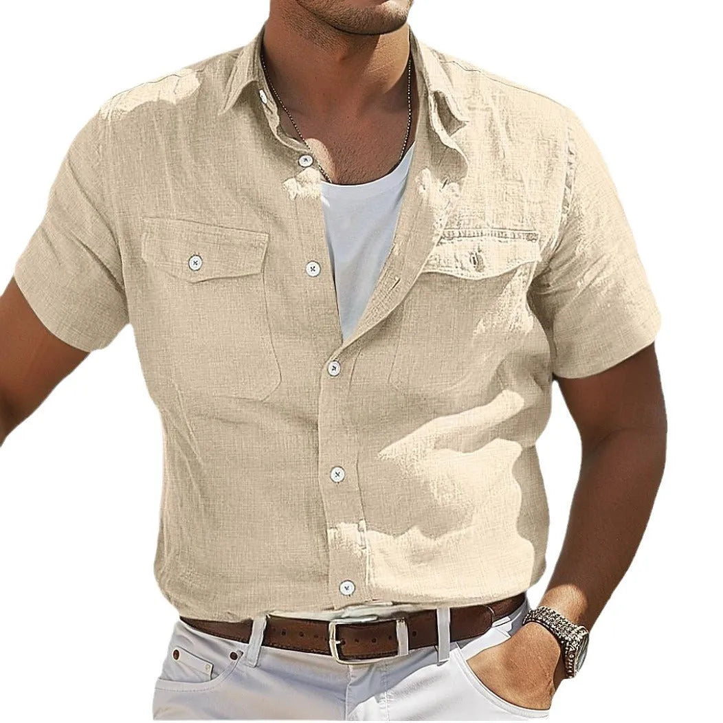 Man wearing a loose grey cotton cardigan-style shirt with long sleeves.