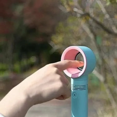 A compact portable bladeless fan with USB cable, shown in one of the available colours like blue or white.