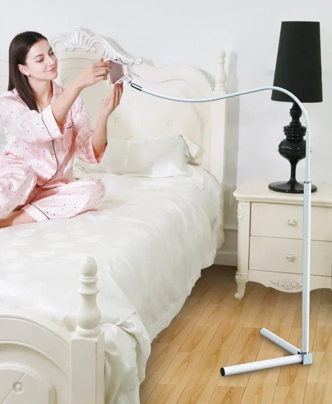 Mobile phone bed bracket with overhead support shelf in black mounted beside bed with phone secured in universal folder