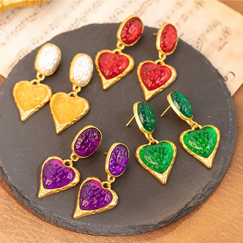 Silver pleated heart-shaped stud earrings in purple, red, green, and yellow/white colours.