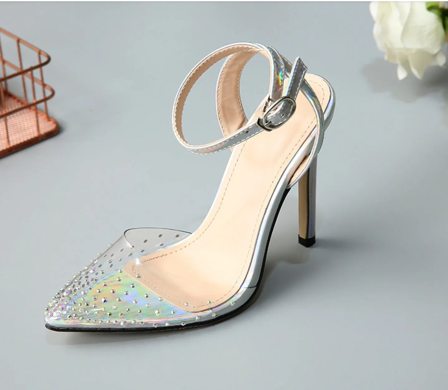 Women's pointed toe stiletto sandals with diamond ornamentation on a PVC upper.