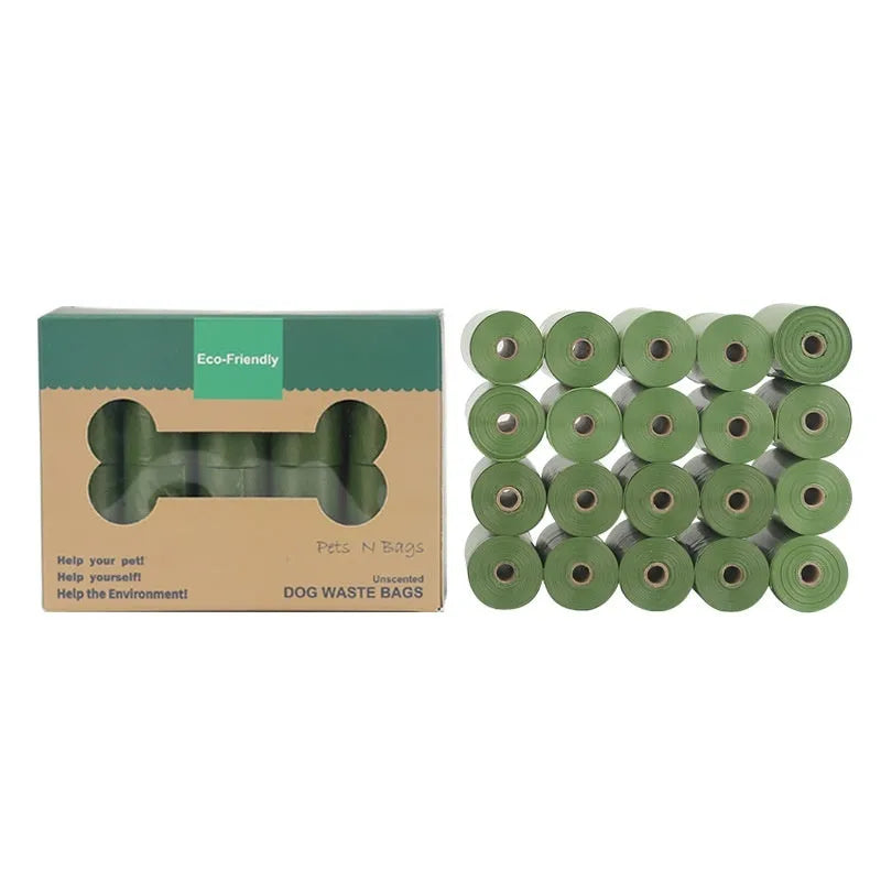 Roll of green EPI degradable pet garbage bags next to a boxed set with a dispenser.