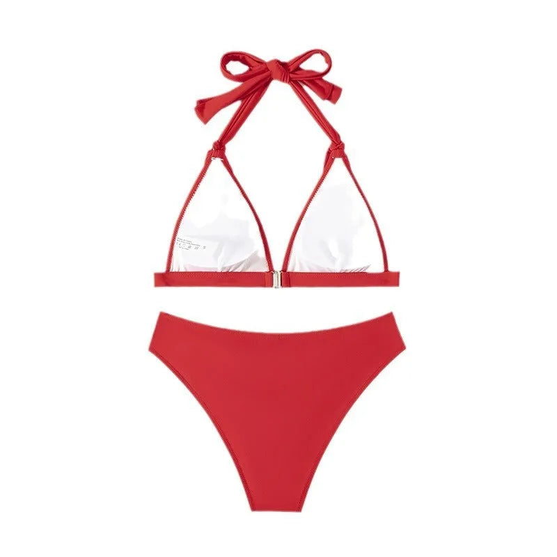Red women's bikini with lace-up halterneck top and split shorts