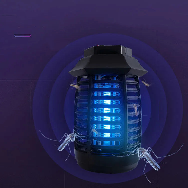 Black aromatherapy mosquito lamp insect killer with choice of international plug styles on a table.